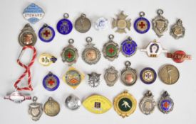 Thirty two hallmarked silver, enamel and other sports medals and badges to include Football