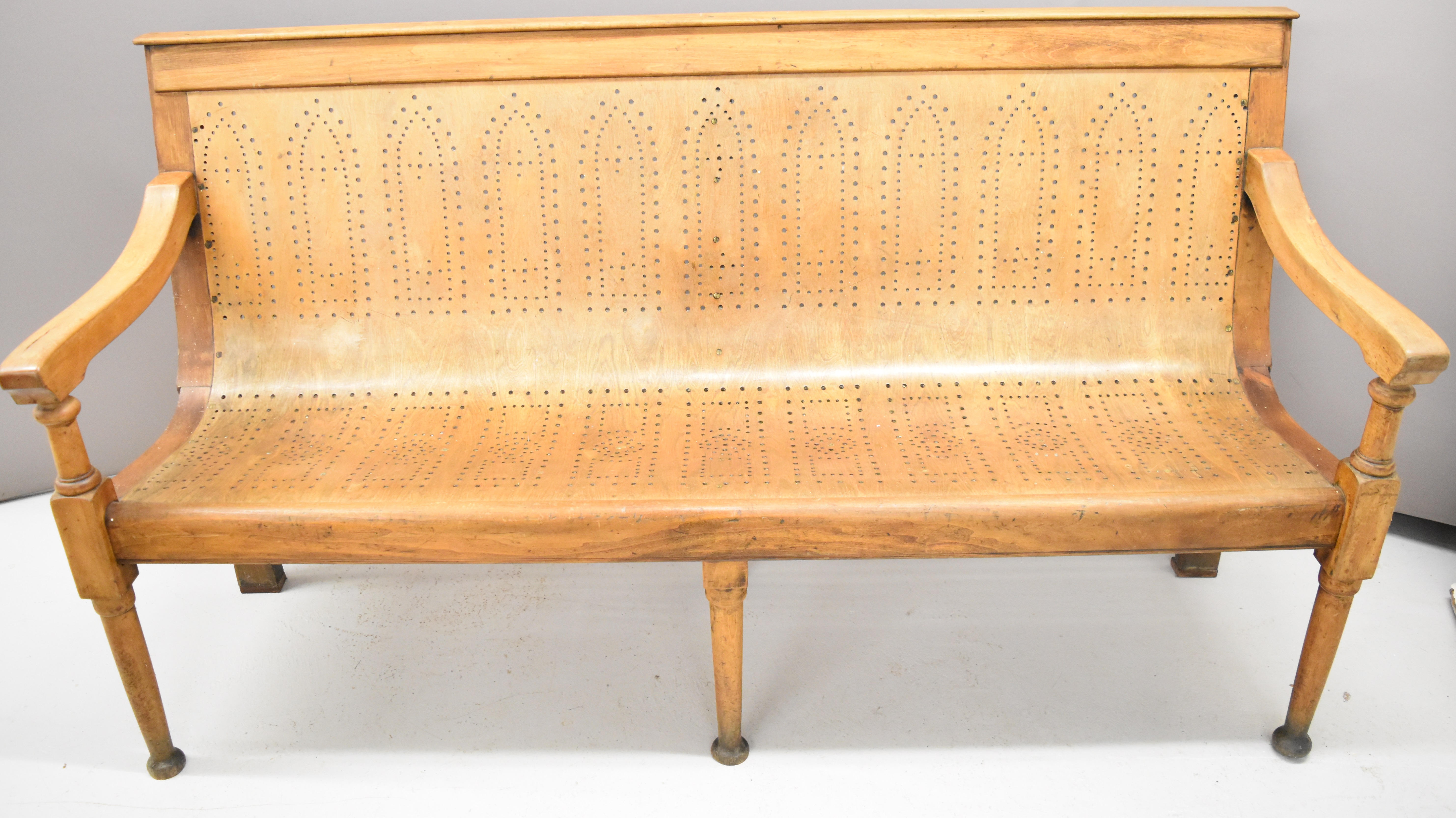 19thC pierced ash bench raised on six legs, length 174.5cm