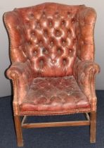 Georgian style red Chesterfield wing back armchair, probably early 20thC, height 110cm