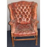 Georgian style red Chesterfield wing back armchair, probably early 20thC, height 110cm