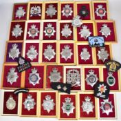 Approximately 250 Police badges, helmet plates and cloth insignia including Royal Ulster