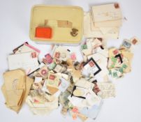 A tin of old GB stamps Queen Victoria to King George V on pieces, loose and on covers including a