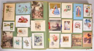 A large album of mainly Christmas greetings cards, early 20thC onwards including winter scenes,