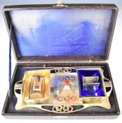 Olympics interest cased silver plated four piece desk set, each piece decorated with the Olympic