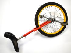 Unicycle with red and yellow finish, height to top of seat post 72cm, current saddle height 88cm.