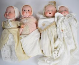 Four Armand Marseille bisque headed dolls each marked AM Germany to back of neck, tallest 46cm.