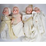 Four Armand Marseille bisque headed dolls each marked AM Germany to back of neck, tallest 46cm.