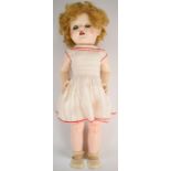 Pedigree plastic bodied doll with blonde hair, blue weighted eyes, red lips and tinted cheeks,