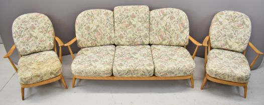 Ercol mid century modern light elm suite of furniture comprising sofa and two armchairs with