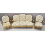 Ercol mid century modern light elm suite of furniture comprising sofa and two armchairs with