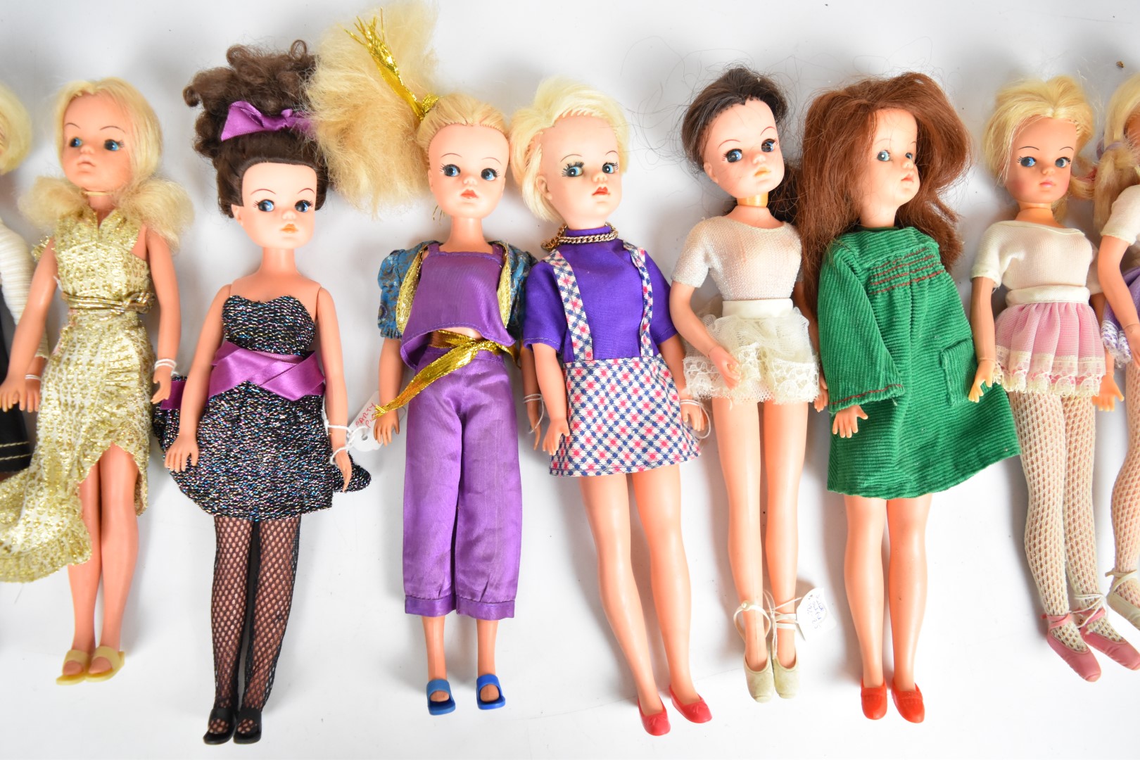 Ten vintage Sindy dolls by Pedigree dressed in clothing ranging from the 1960's to 80's. - Image 3 of 4