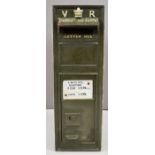 Victorian cast iron wall mounted letter box with VR cypher and crown to top, the door having
