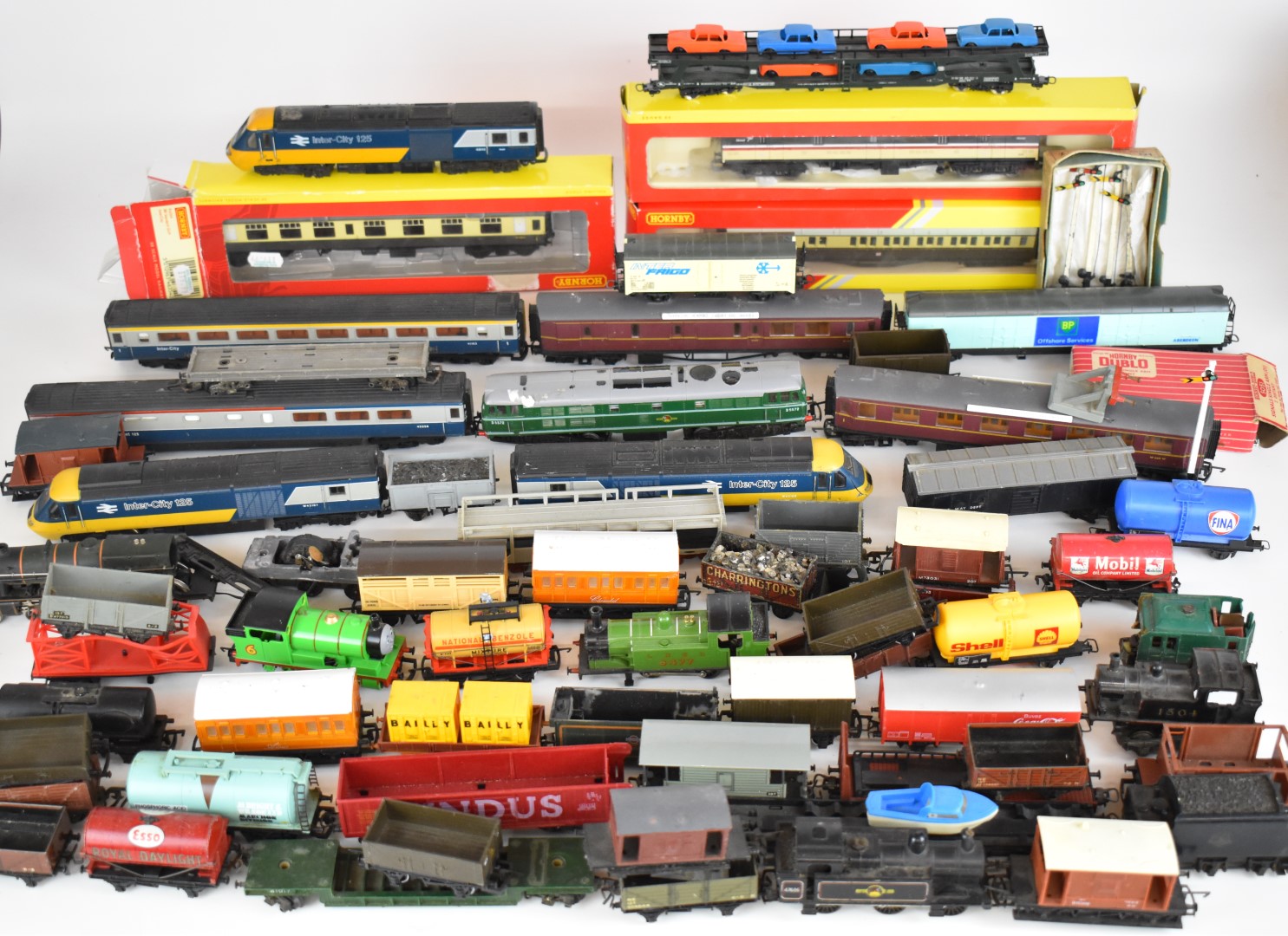 A collection of 00 gauge model railway locomotives, passenger carriages and goods wagons to