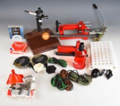 A collection of rifle or shotgun cartridge re-loading equipment including Lee press, primers etc