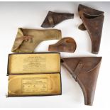 Five leather pistol or revolver holsters including one stamped 'Martins B'ham Ltd 1915' together