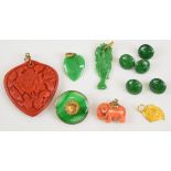 A yellow metal pendant (tests as 18k, 1g), two jadeite pendants one carved in the form of a fish and
