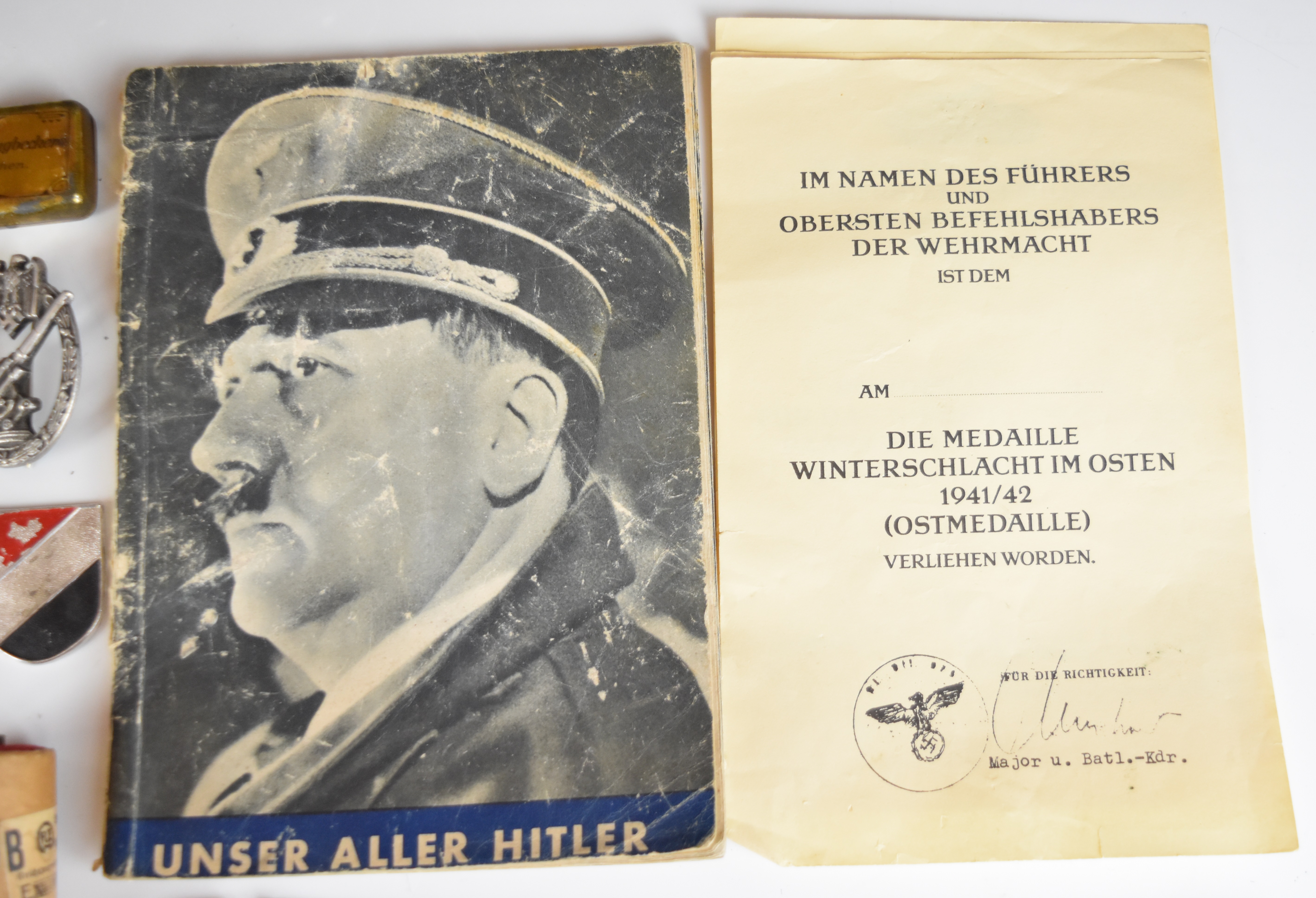 Mainly reproduction German WW2 Nazi insignia, booklets etc - Image 8 of 16