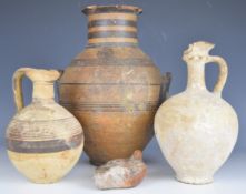 Collection of Roman / Greco Roman and later pottery items including twin handled urn, ewers etc,
