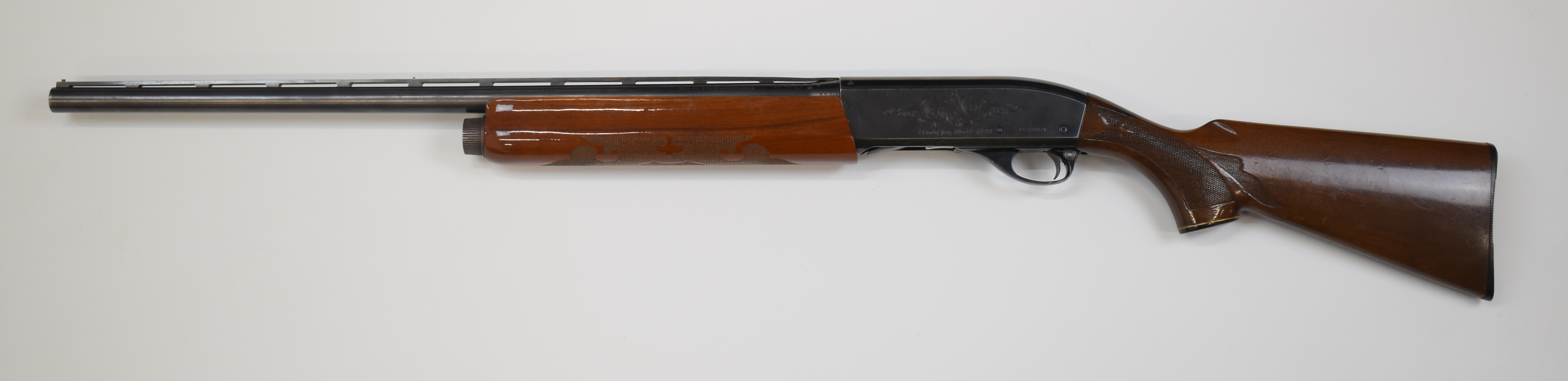 Remington Model 1100 12 bore 3-shot semi-automatic shotgun with ornately carved and chequered semi- - Image 6 of 10