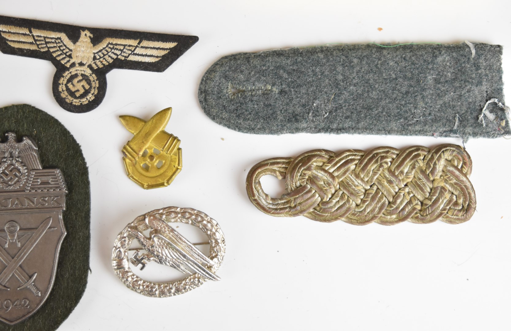 Mainly reproduction German WW2 Nazi insignia, booklets etc - Image 10 of 16