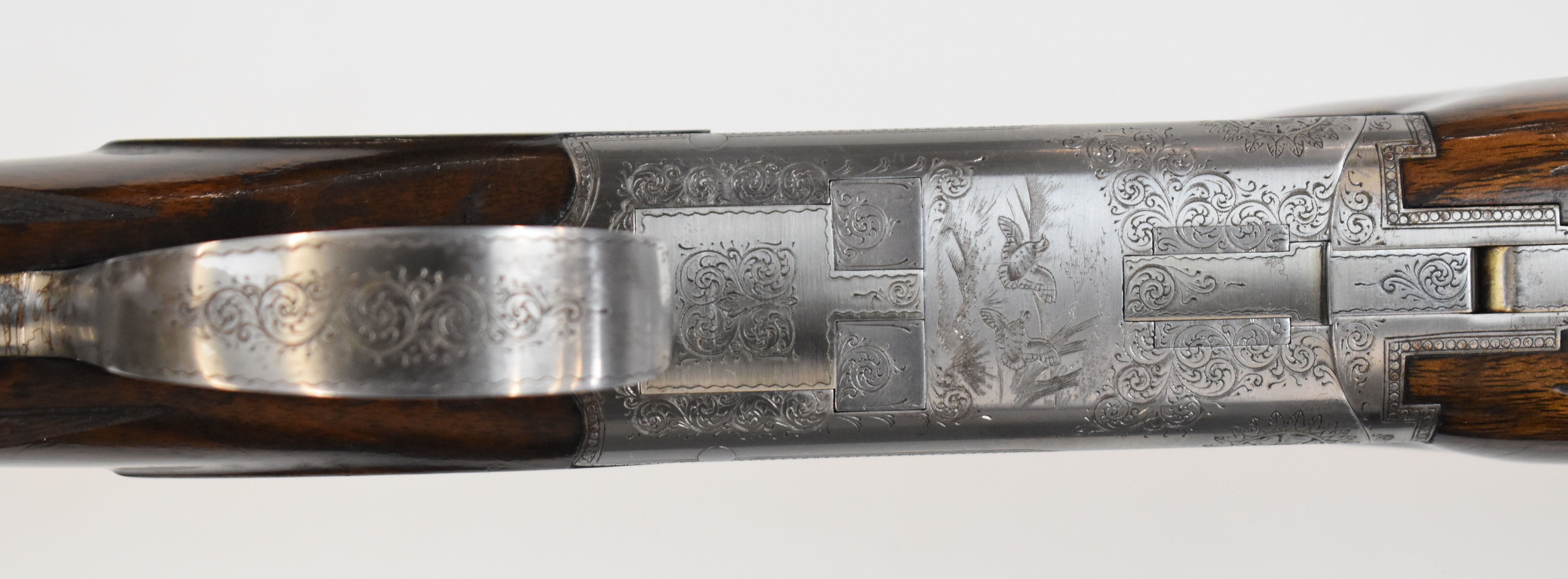 Browning B2 12 bore over and under shotgun with engraved scenes of birds to the locks and underside, - Image 7 of 12