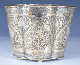 19thC Chinese, Burmese or similar Eastern silver wine cooler raised on three ball feet decorated