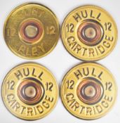 A set of five place mats in the form of Hull and Eley shotgun cartridge ends, each 28cm in diameter.