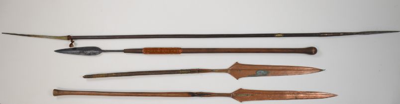 Collection of African tribal spears including a push / thrusting spear, copper examples, etc
