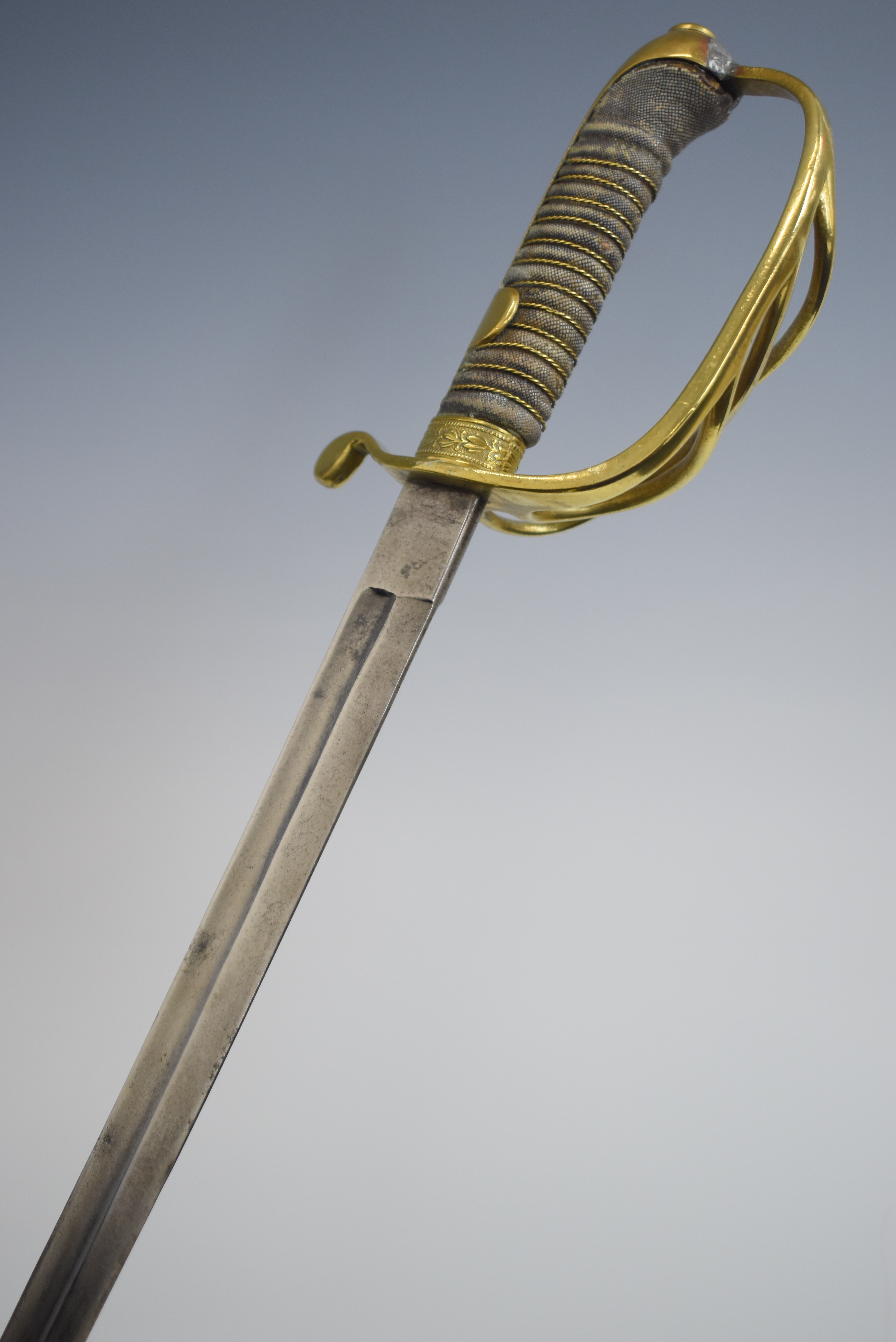 Continental sword with four bar brass hilt, shagreen and wire grip and 70cm curved blade. PLEASE
