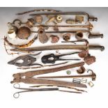 Collection of battlefield finds including grenades, fuses, bayonets, wire cutters, barbed wire, etc