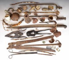 Collection of battlefield finds including grenades, fuses, bayonets, wire cutters, barbed wire, etc