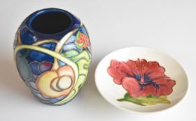 Moorcroft vase decorated in the Queen's Choice pattern and a pin dish decorated in the Hibiscus