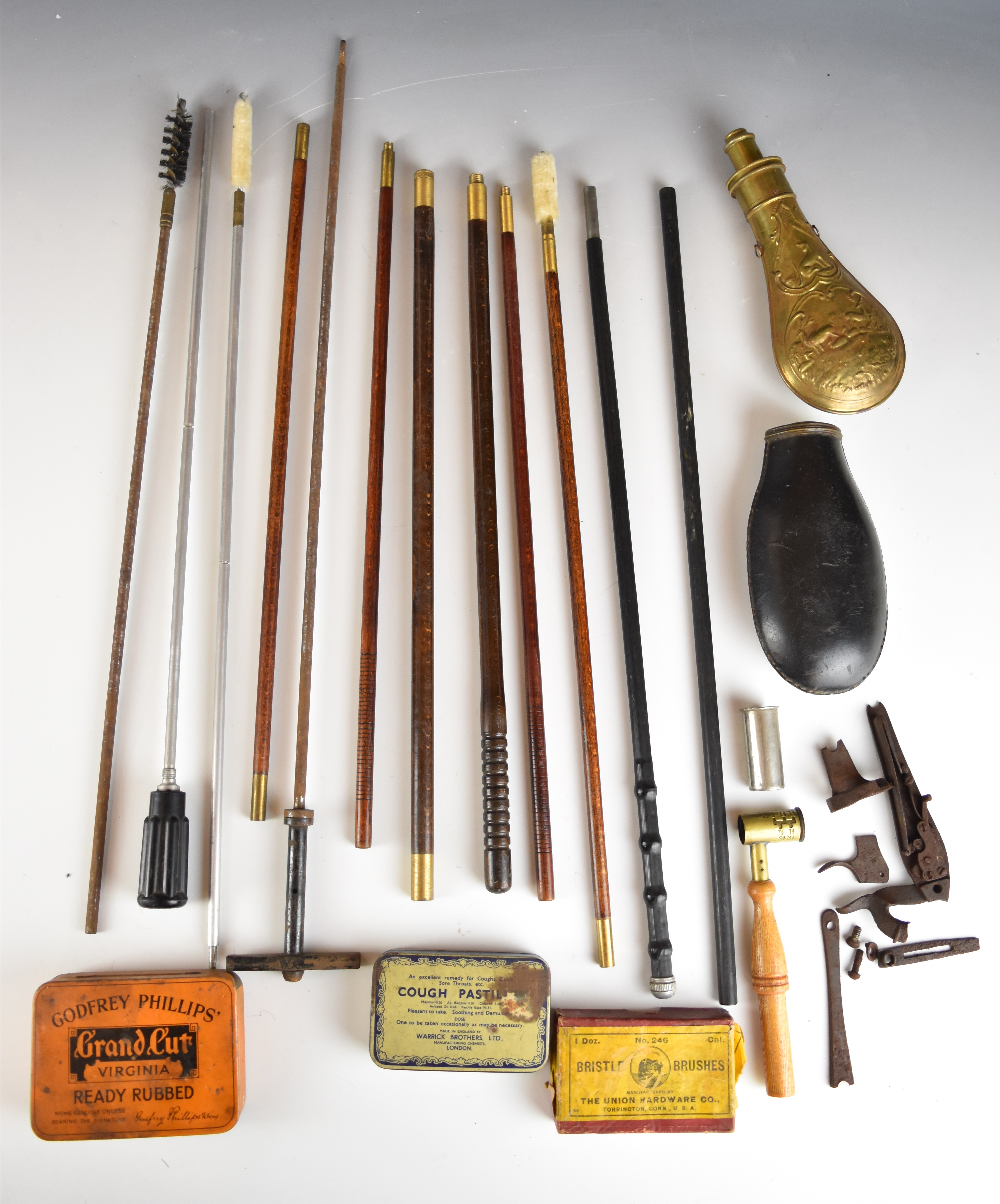 A collection of shotgun or rifle accessories including cleaning rods, powder flasks, gun locks etc.