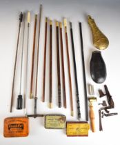 A collection of shotgun or rifle accessories including cleaning rods, powder flasks, gun locks etc.