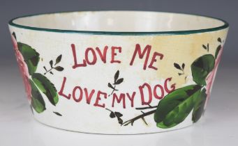 Wemys pottery dog bowl with 'Love Me Love My Dog' and rose decoration, diameter 21.5cm x height 9.
