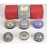 Six millefiori glass paperweights including Perthshire and Peter McDougal examples, some in original