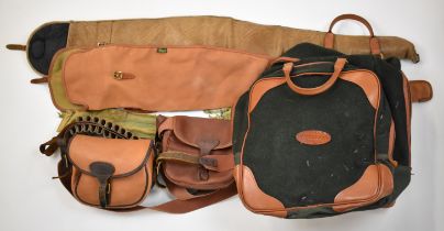 Six various shotgun or shooting accessories comprising two leather cartridge bags, two gun slips,