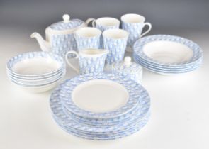 Dior designer porcelain dinner and teaware with Dior motif decoration, approximately 27 pieces,