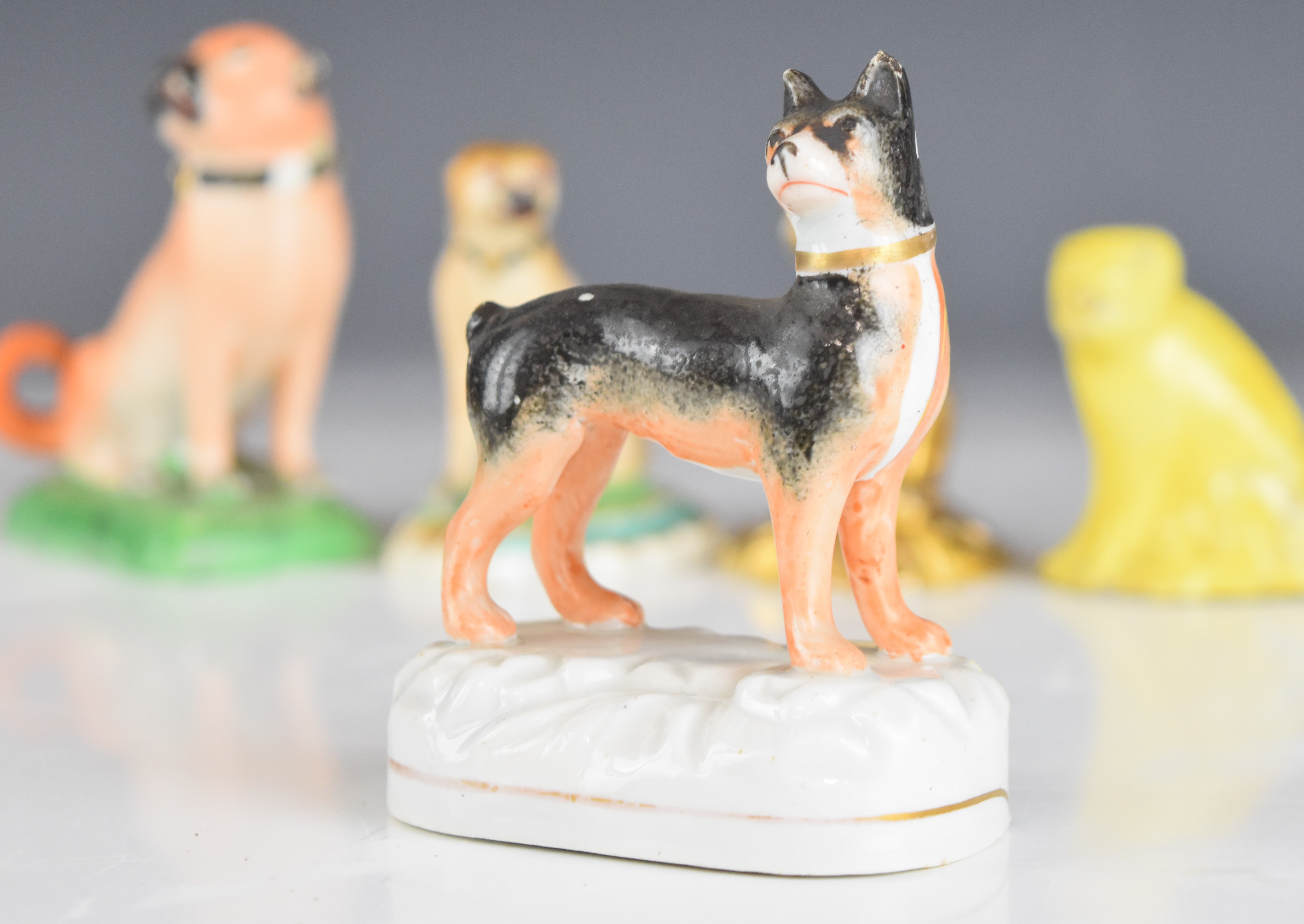 Collection of 19thC miniature porcelain / pottery pug figures including Crown Derby, tan example - Image 3 of 14