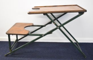 A folding metal shooting or rifle bench with wooden top.