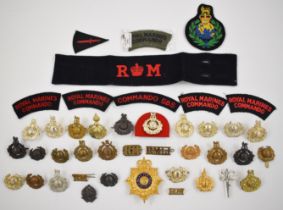 Collection of approximately 40 Royal Marines Commando badges including Light Infantry, Labour