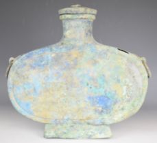 Chinese archaic bronze covered twin handled moon flask with the remains of blue paintwork, width