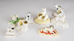 A collection of 19thC miniature Staffordshire and salt glazed stoneware cat and dog figures