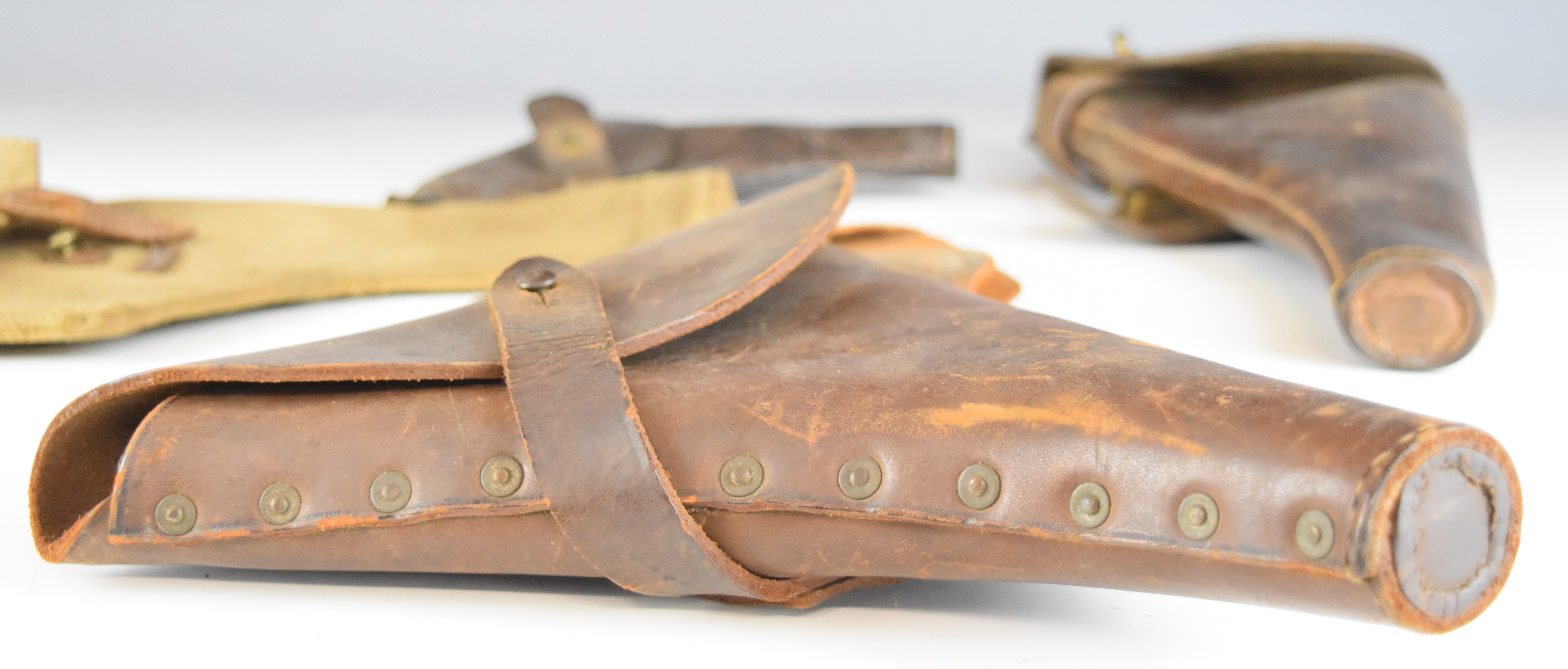 Five leather pistol or revolver holsters including one stamped 'Martins B'ham Ltd 1915' together - Image 3 of 9