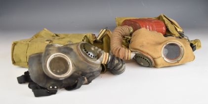 Two British WW2 respirators / gas marks, one by Dunlop the other Avon, both with haversacks