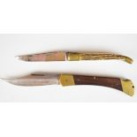 Two folding pocket knives one Laguiole with horn or similar handle and 10cm blade the other Puma