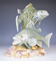 Cobridge stoneware pottery trial model of two fish, possibly carp, raised on a naturalistic pebble