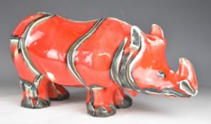 David Sharp, Rye Pottery red rhino, signed to base, length 43cm