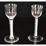 Two Georgian drinking glasses each with cotton twist stem, largest 14.5cm tall.