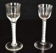 Two Georgian drinking glasses each with cotton twist stem, largest 14.5cm tall.